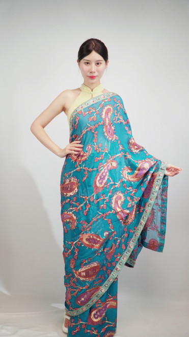 Teal Blue Saree with Vibrant Multicolor Paisley Patterns & Contrasting Silver Border Teal Blue Saree with Vibrant Multicolor Paisley Patterns & Contrasting Silver Border