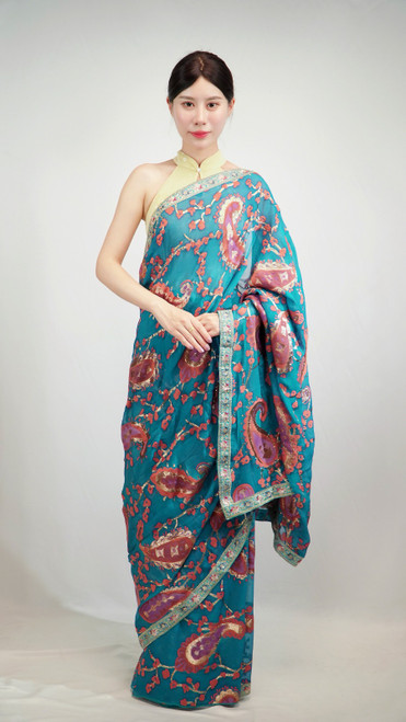 Teal Blue Saree with Vibrant Multicolor Paisley Patterns & Contrasting Silver Border Teal Blue Saree with Vibrant Multicolor Paisley Patterns & Contrasting Silver Border