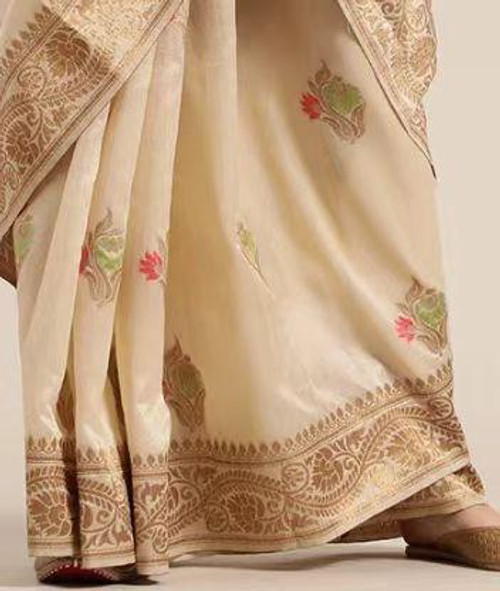 Regal Cream Silk Saree with Floral Motifs & Rich Zari Border Regal Cream Silk Saree with Floral Motifs & Rich Zari Border