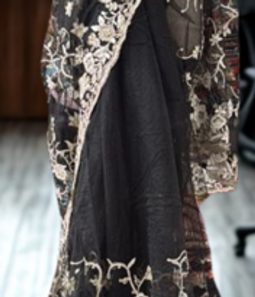 Black Net Saree with Antique Gold Floral Embroidery & Luxe Detailing Black Net Saree with Antique Gold Floral Embroidery & Luxe Detailing