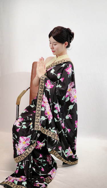 Elegant Black Floral Print Saree with Ornate Gold Border Elegant Black Floral Print Saree with Ornate Gold Border