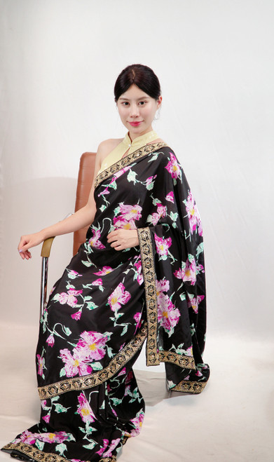 Elegant Black Floral Print Saree with Ornate Gold Border Elegant Black Floral Print Saree with Ornate Gold Border
