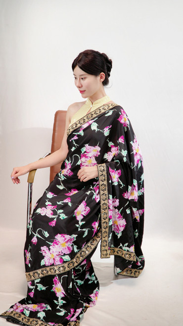 Elegant Black Floral Print Saree with Ornate Gold Border Elegant Black Floral Print Saree with Ornate Gold Border