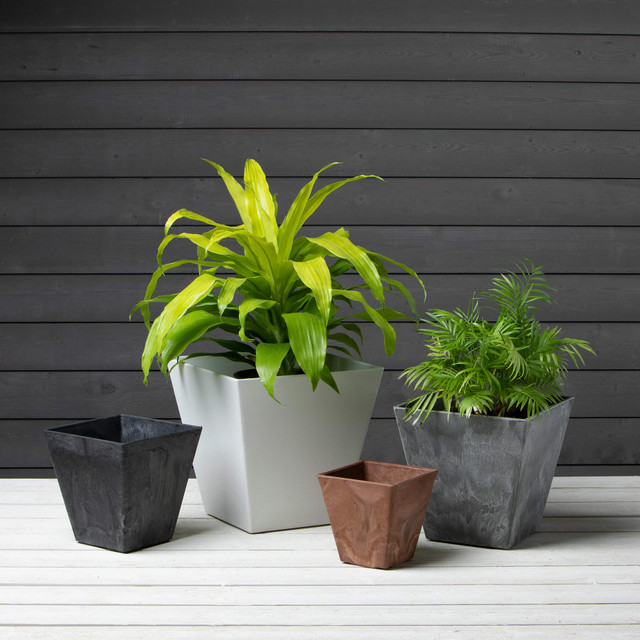 Collection of four square planters in different sizes and colors