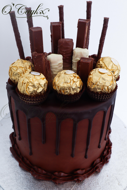 Double Chocolate Sweetie Drip cake

Please note that types of chocolates/sweeties used, are subject to availability, and therefore might not look exactly like image represented