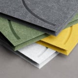 Soft Panels pour meuble Cubox empilés en gris granit, gris glacier, vert mousse et jaune soleil, vue détaillée de la texture feutre