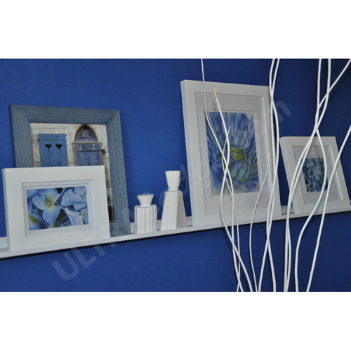white ledge with frames