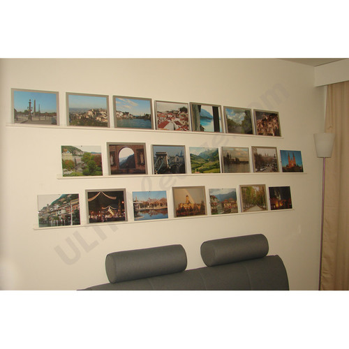 three 6' white ledges with picture frames