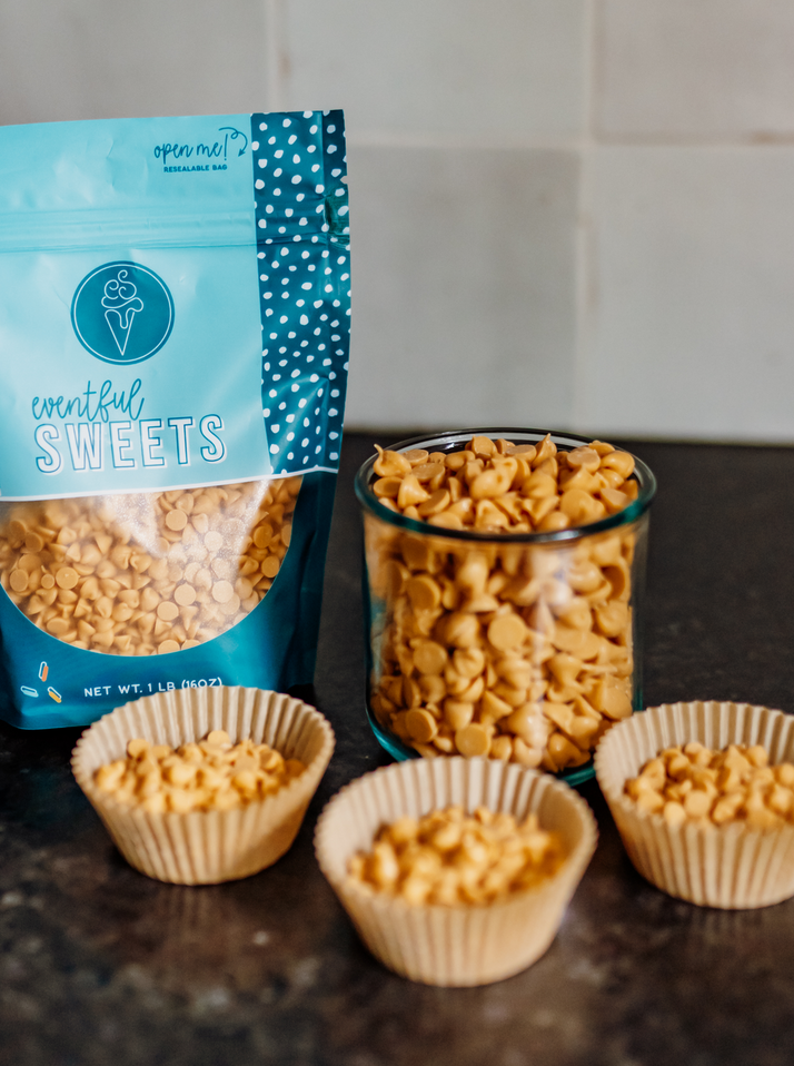 The image shows a group of bowls filled with Peanut Butter Chips, with a resealable bag in the background.