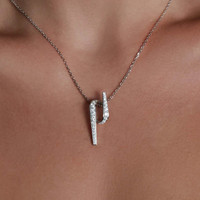 Model wearing Frammenti necklace in 18k white gold with diamonds, high-end artisanal Italian jewelry.