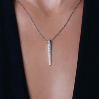 Model wearing Frammenti necklace in 18k white gold and diamonds, high-quality luxury Italian jewelry.