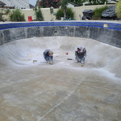 Workers on swimming pool construction