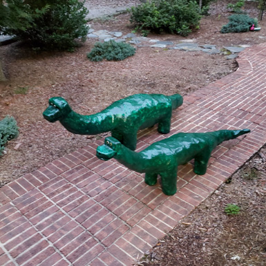 Green fiberglass structure dinasours