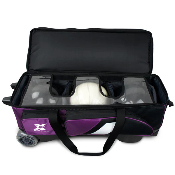 Open top of Tenth Frame purple Deluxe Triple Roller with three bowling balls in padded compartment
