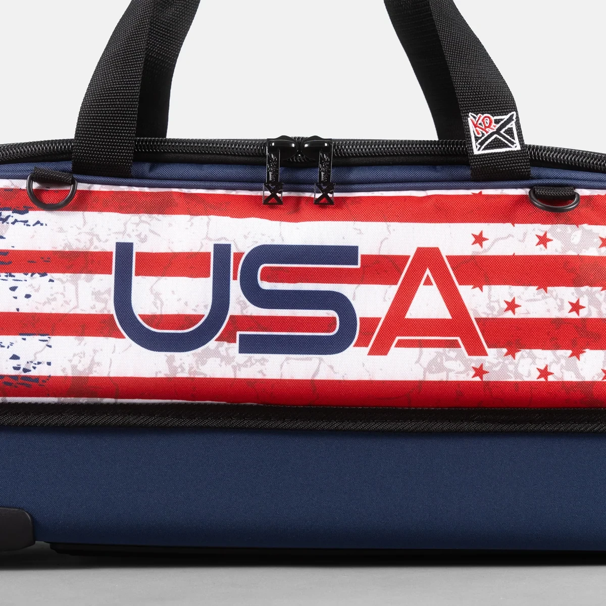 Close-up of USA lettering and distressed flag graphic on KR Strikeforce Slim Triple Tote