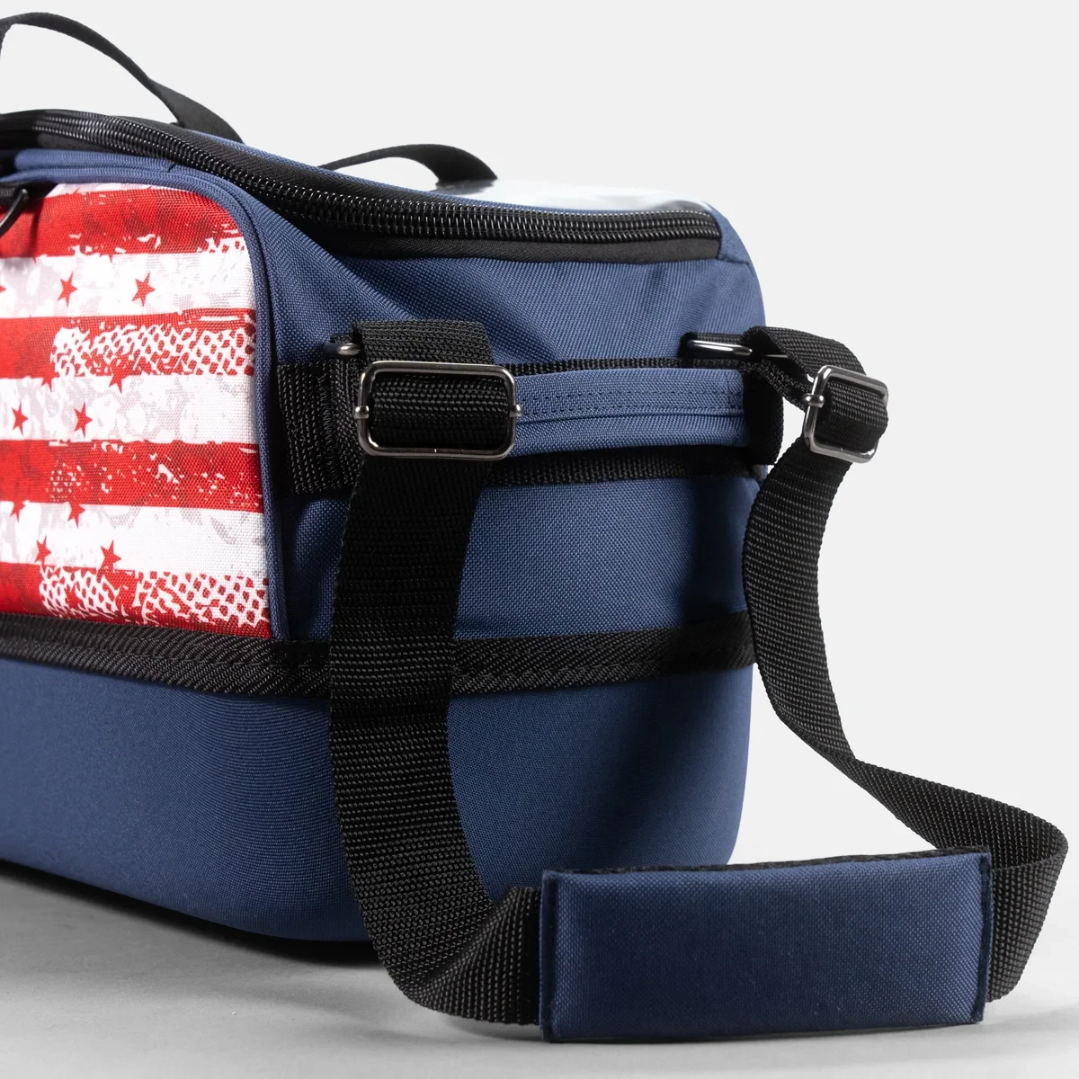 Padded carry handles and adjustable tow strap on KR Strikeforce USA Slim Triple Tote