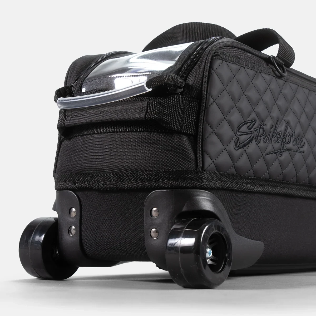 Wide skateboard-style wheels and EVA base on black KR Strikeforce Diamond Slim Triple Tote