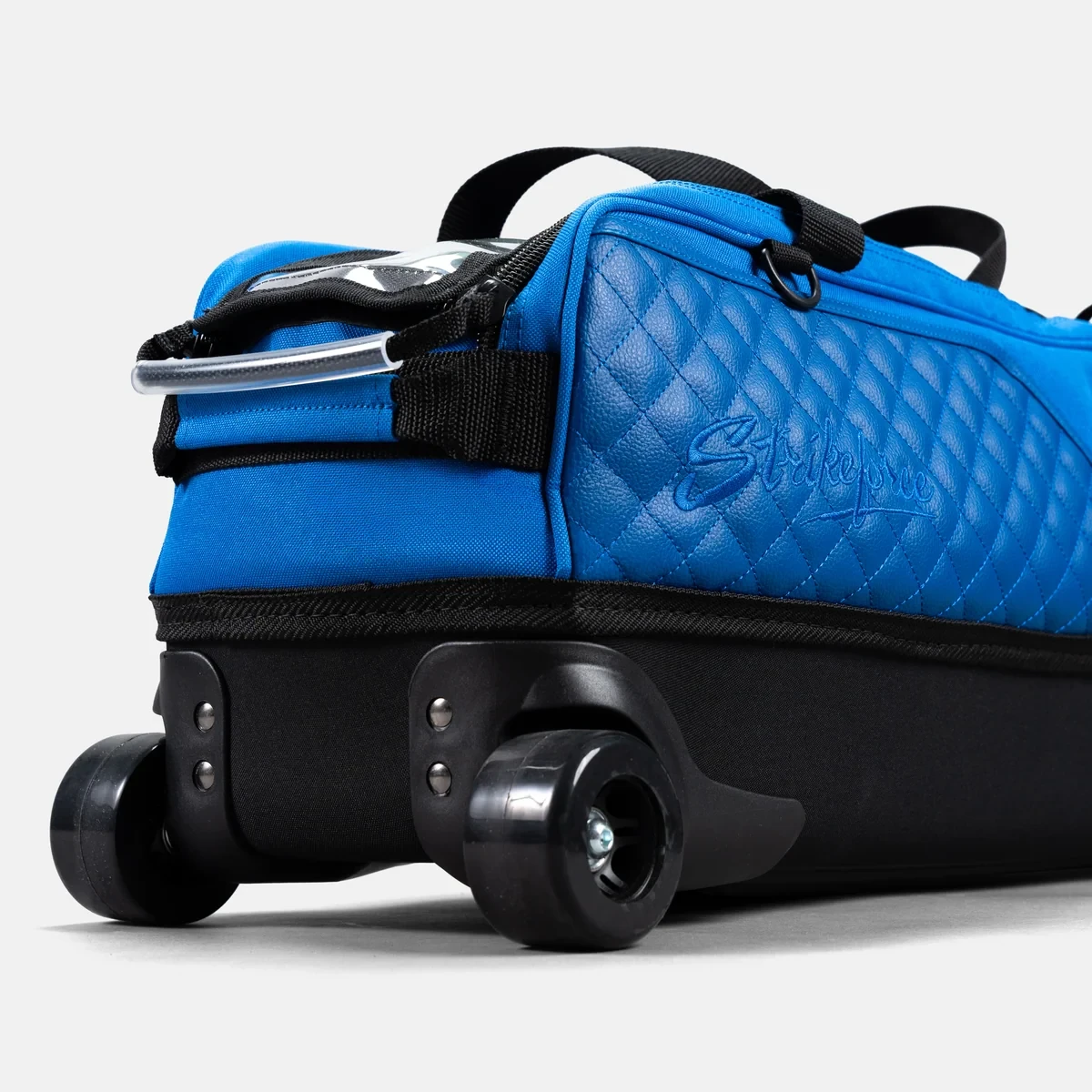 Wide skateboard-style wheels and black EVA base on Baltic Blue Diamond Slim Triple Tote