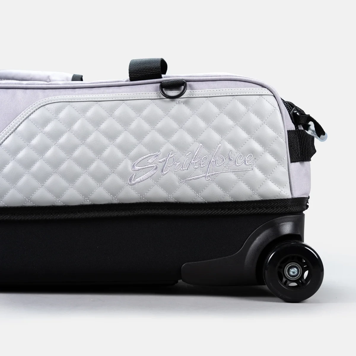Grey quilted leather panel with embossed Strikeforce logo on Diamond Slim Triple Tote