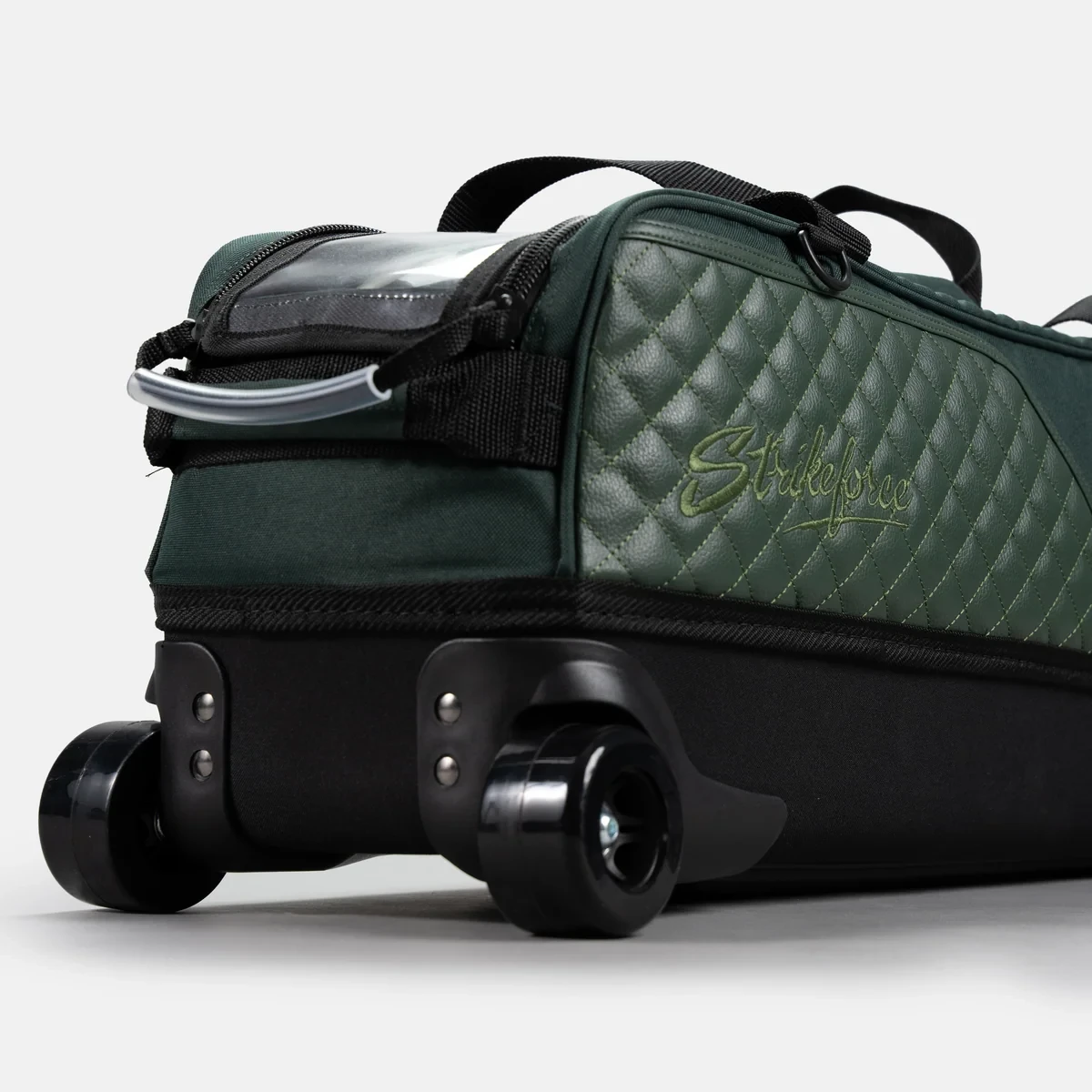 Wide skateboard-style wheels and black EVA base on Hunter Green Diamond Slim Triple Tote