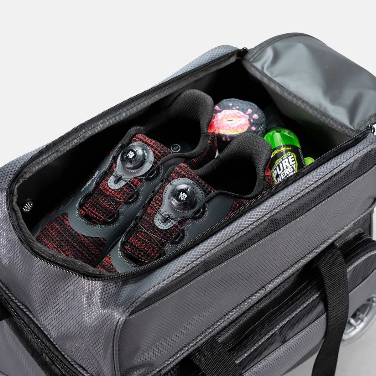 Bowling shoes and accessories in top shoe compartment of KR Strikeforce Konvoy Double Roller