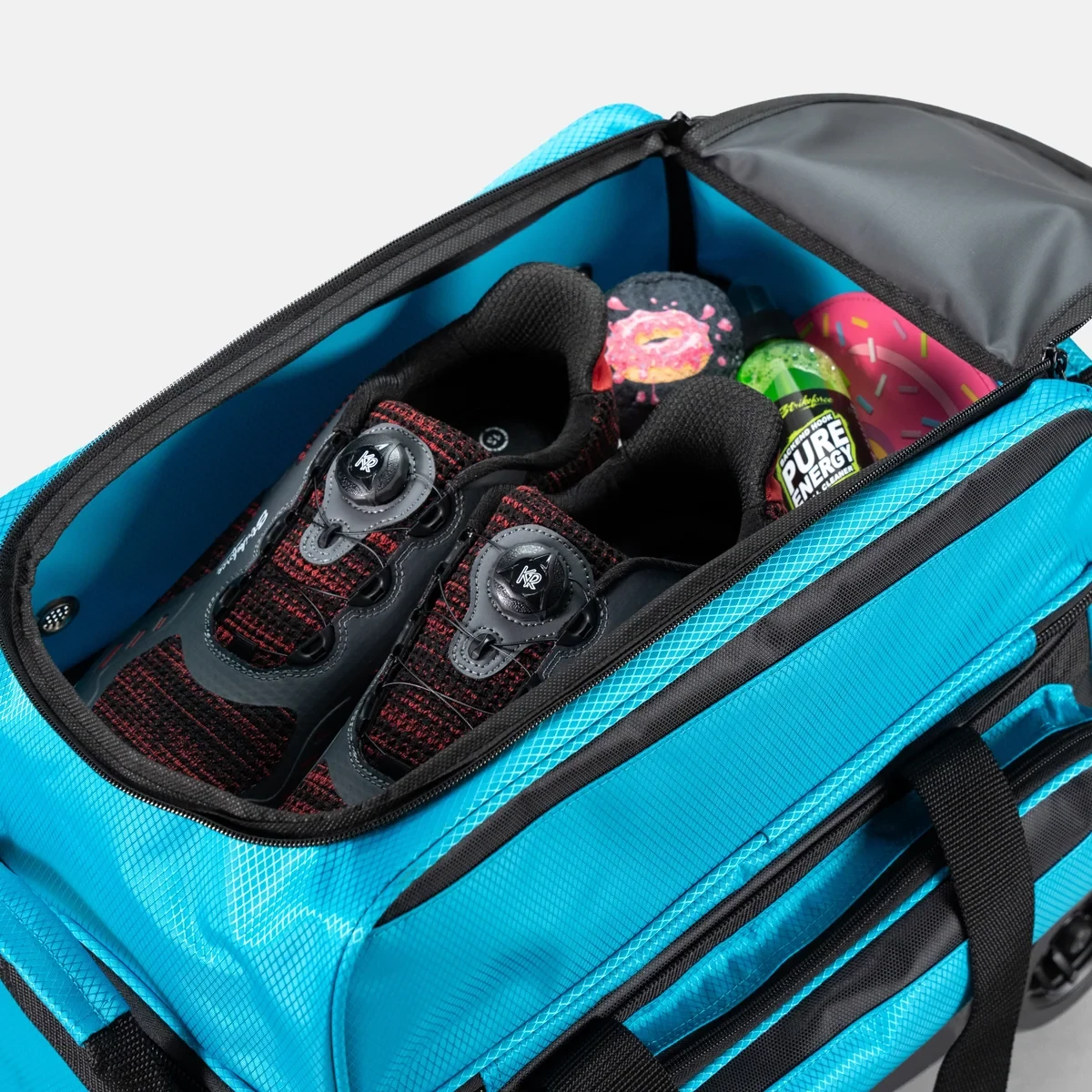 Bowling shoes and accessories in top shoe compartment of black/Caribbean blue Konvoy Double Roller
