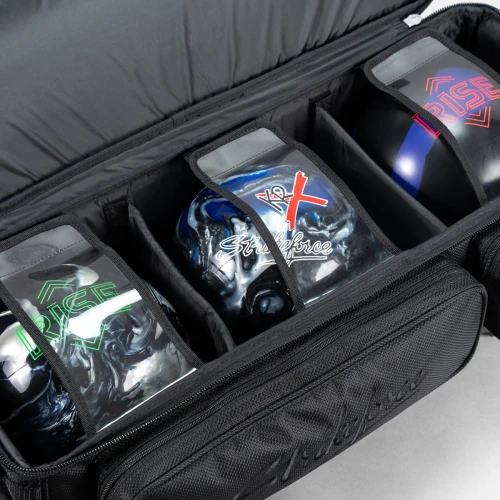 Three bowling balls in padded dividers inside KR Strikeforce Diamond Dually triple roller