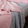 Musk Pink bedspread with 180 GSM pure linen sheets in Dove Grey. 