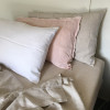 In this image we have a mixture of our farmhouse, frayed Linen pillowslips, that can be bought as separates, and our White Linen to show mix and match ideas.