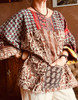 Warm chocolate tones with a large front pocket. Sized to fit from Adult 10 to 16. See the measurements in the listing.
