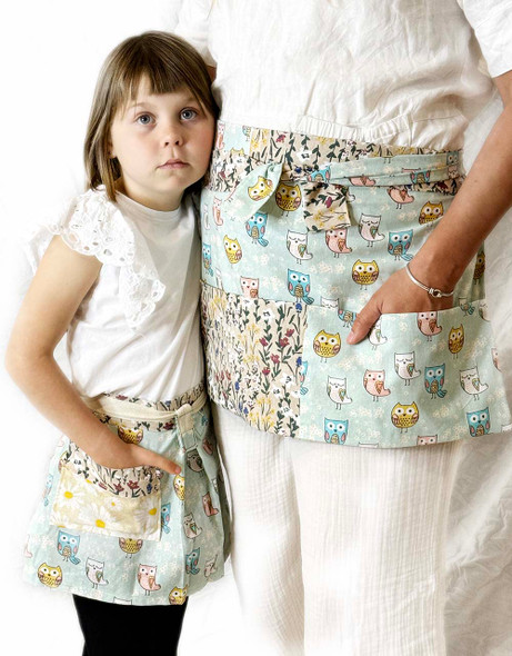 Twin apron set designed to delight both child and adult with the fun owl design and front pockets.