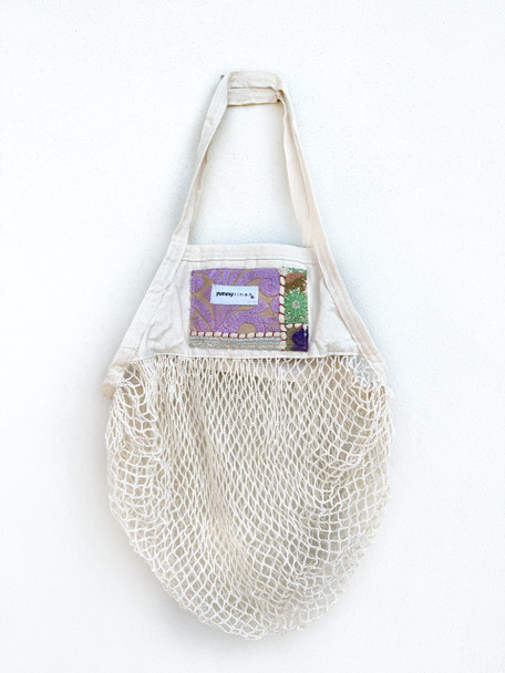 Embroidered applique designs with a bohemian vibe. A fun yet elegant look for your string shopping tote.