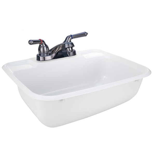 White RV bathroom sink with a brushed nickel faucet.