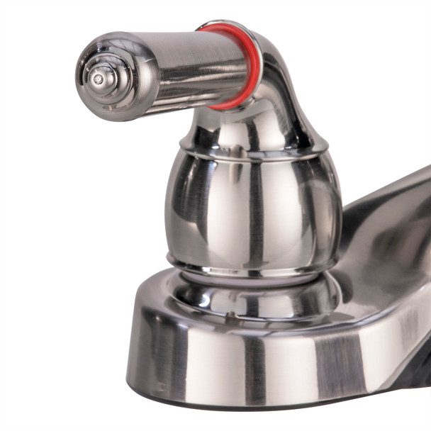 Close up on the faucet hot handle. Close up on the faucet hot handle.