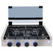 Stainless steel three burner gas cooktop with glass cover up front view.