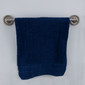 RV brushed nickel towel rack with a blue towel hanging on it.