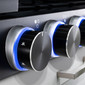 Close up on control knobs with the LED light rings glowing blue.