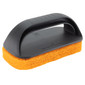 Scour pad with black plastic handle.