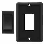 Black RV momentary rocker switch with optionsal wall mount cover next to it.
