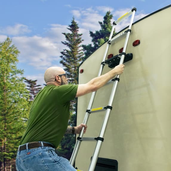 person climbing up telescoping ladder with bracket 
