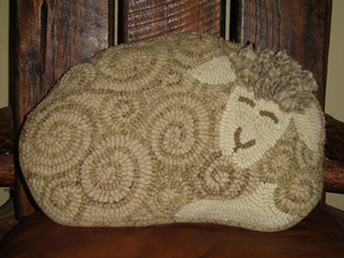 This was hooked and turned into a pillow by Tammy Burks.