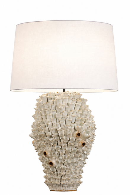 Handmade Thai white sea anemone ceramic table lamp with sculpted cream and ivory ceramic base and neutral fabric shade on white background