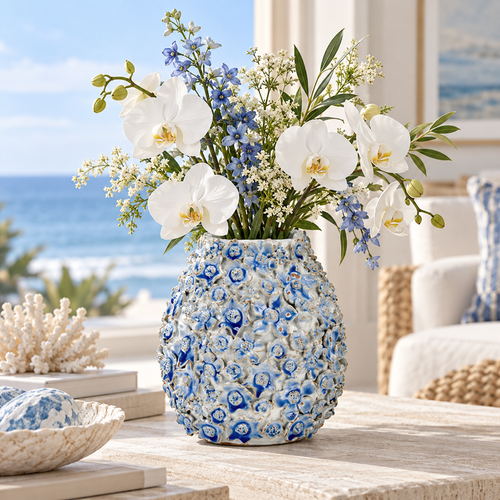 Light blue Bouquet de Fleurs ceramic vase styled with white flowers in a bright coastal interior