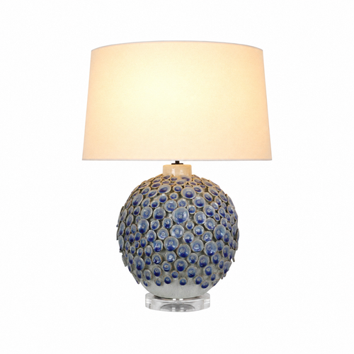 Handmade Thai Flor Azul blue floral ceramic table lamp, 25-inch lamp with sculpted blue blossom base and light drum shade.