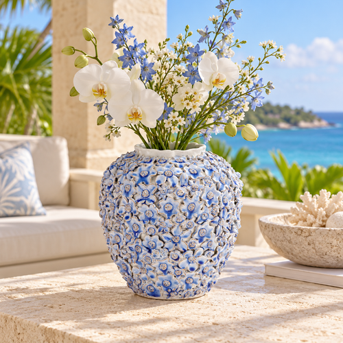 Medium light blue Bouquet De Fleurs ceramic vase styled with delicate stems in a bright coastal setting