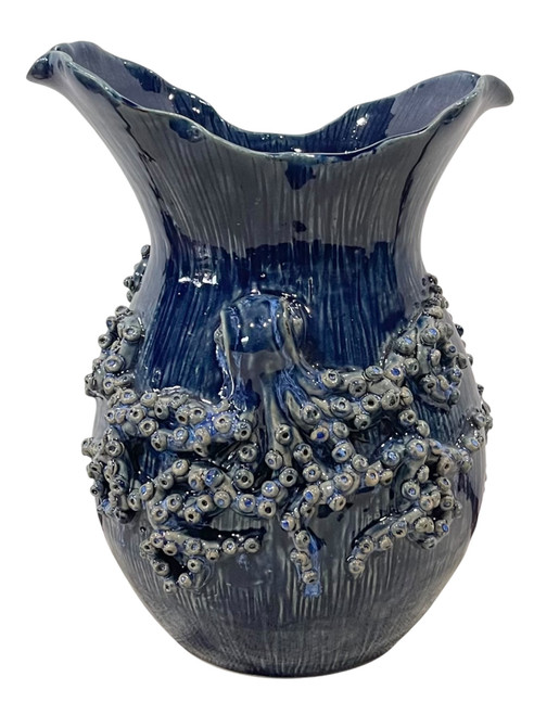 Azure Reef blue octopus ceramic vase with sculpted tentacles and dimensional suction-cup detailing on white background.