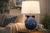 Handmade Thai blue sea anemone ceramic table lamp styled beside seating in a sophisticated coastal interior