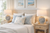 Handmade Thai blue ceramic sea anemone table lamp L452B styled in a bright coastal bedroom with neutral furnishings