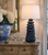 Handmade Thai deep blue coral ceramic table lamp styled on a wood console in an upscale coastal room