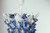 Close up of handmade Thai blue and white barnacle ceramic lamp showing intricate sculpted ceramic marine details